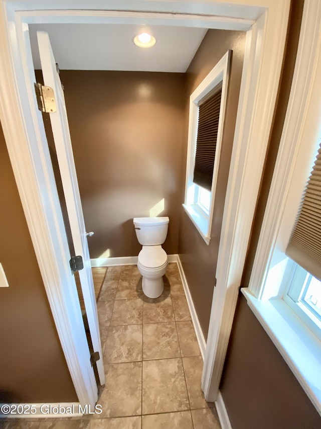 bathroom with tile patterned floors and toilet