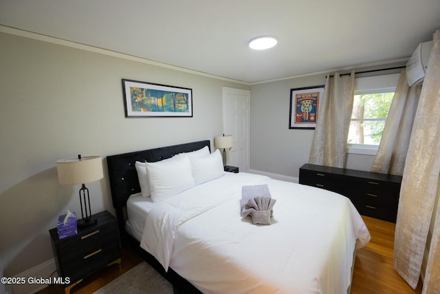 bedroom featuring crown molding and hardwood / wood-style floors