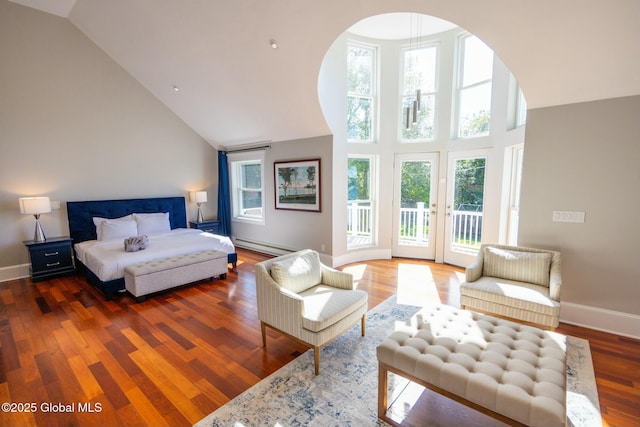 bedroom featuring a baseboard radiator, hardwood / wood-style floors, access to exterior, and high vaulted ceiling