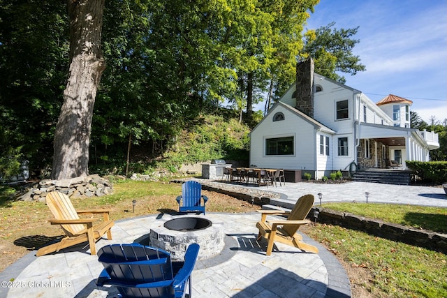 view of patio / terrace with an outdoor fire pit