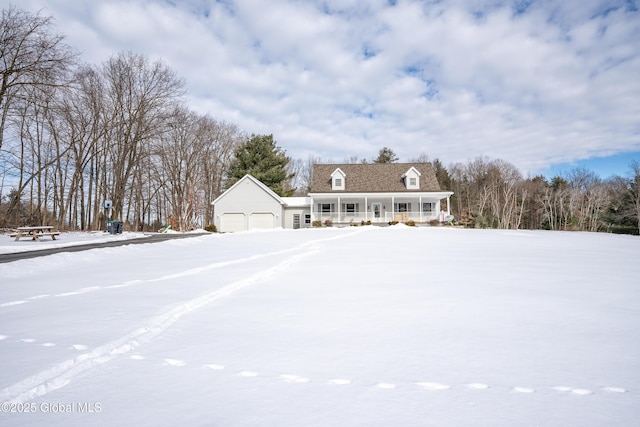 cape cod-style house featuring a garage