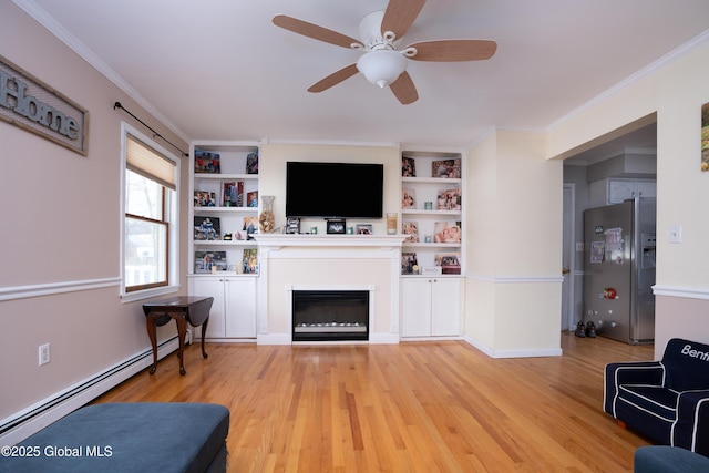 living room with built in features, ceiling fan, a baseboard heating unit, ornamental molding, and light wood-type flooring