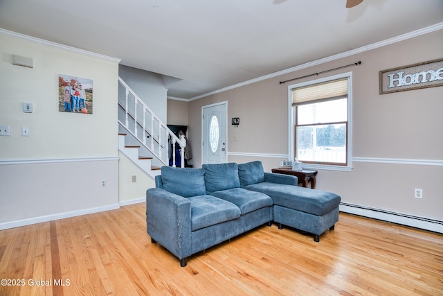 living room featuring crown molding, ceiling fan, baseboard heating, and hardwood / wood-style floors