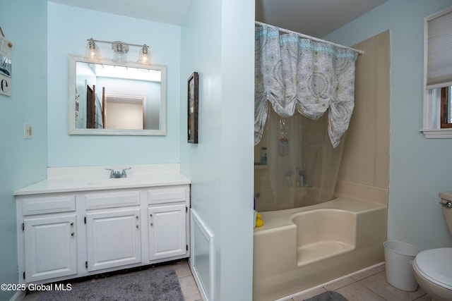 full bathroom featuring vanity, tile patterned floors, toilet, and shower / bath combo with shower curtain