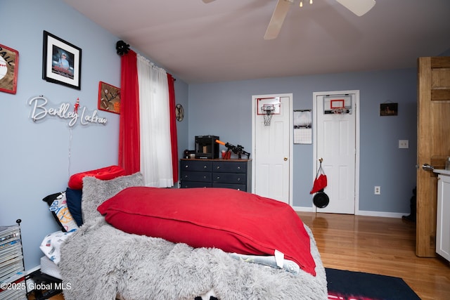 bedroom featuring ceiling fan and hardwood / wood-style floors