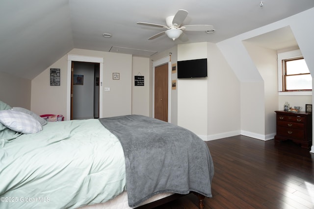 bedroom with ceiling fan, lofted ceiling, and dark hardwood / wood-style floors