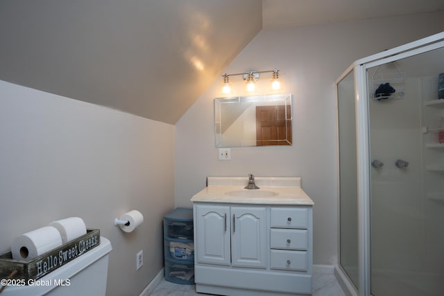 bathroom with vanity, vaulted ceiling, toilet, and walk in shower