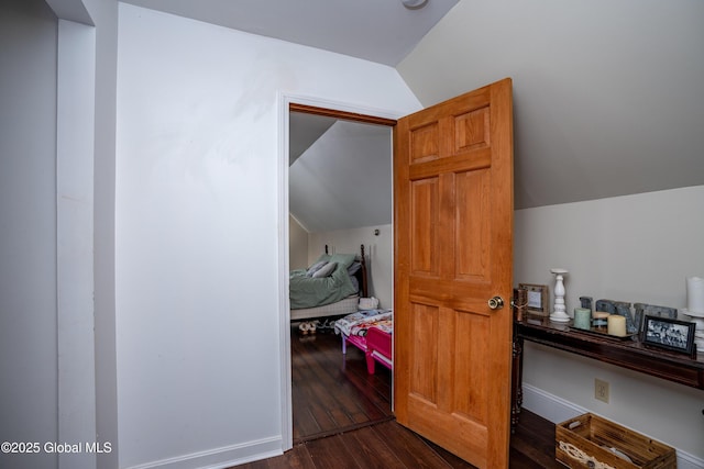 additional living space with lofted ceiling and dark hardwood / wood-style floors