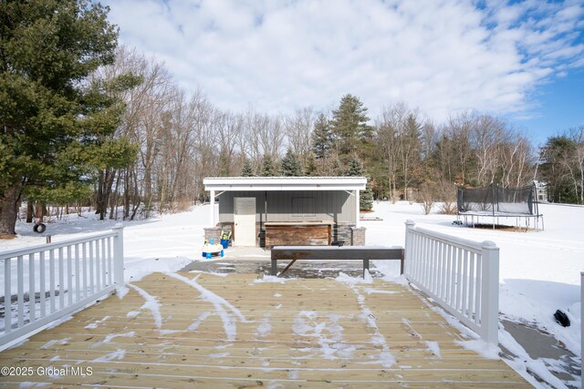 snow covered deck featuring a trampoline