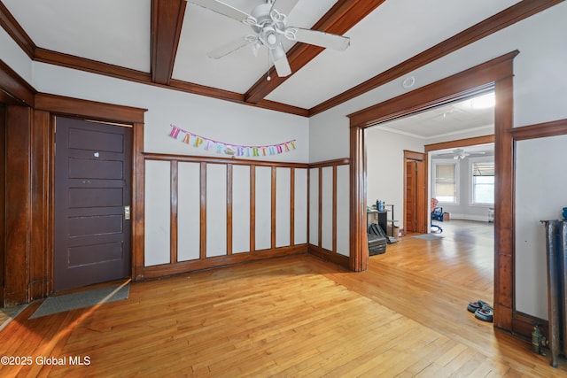 entrance foyer with crown molding, ceiling fan, beam ceiling, and light hardwood / wood-style flooring