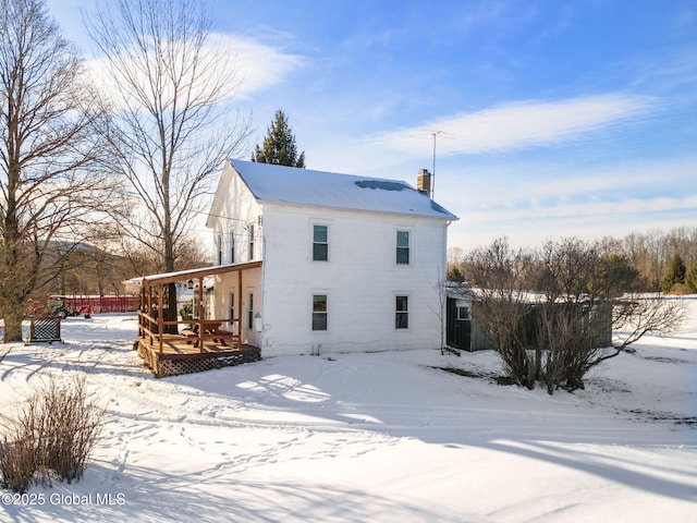 view of snow covered house