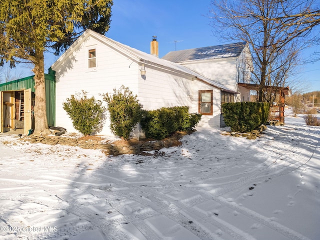 view of snow covered property