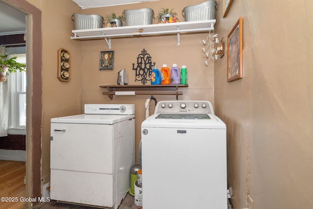 clothes washing area with washer and dryer