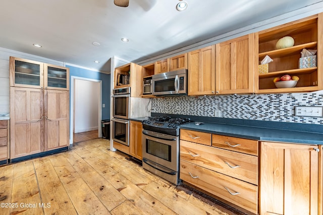 kitchen featuring decorative backsplash, light hardwood / wood-style floors, and appliances with stainless steel finishes