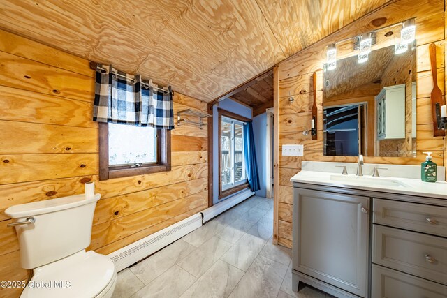 bathroom featuring wood ceiling, baseboard heating, vanity, wood walls, and lofted ceiling