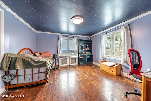 bedroom with ornamental molding and hardwood / wood-style floors