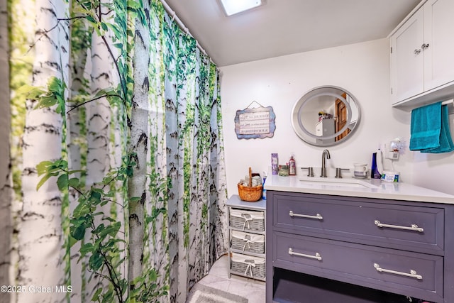 bathroom with tile patterned floors and vanity