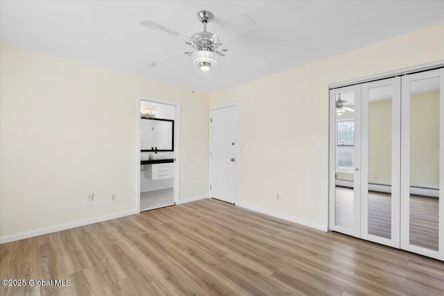 empty room with light wood-type flooring and ceiling fan