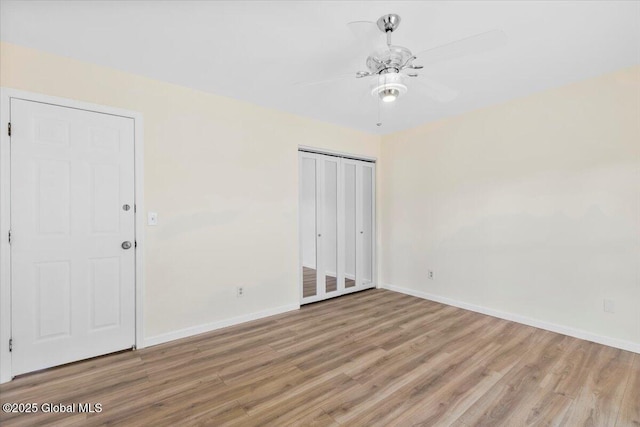 unfurnished bedroom featuring ceiling fan and wood-type flooring