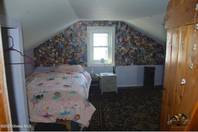 carpeted bedroom featuring vaulted ceiling