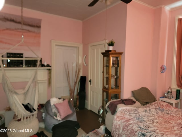 bedroom with ornamental molding and ceiling fan