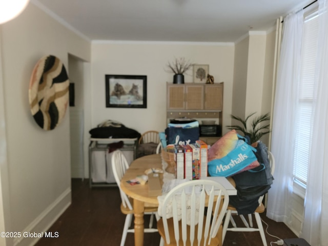 dining space featuring crown molding and dark hardwood / wood-style floors