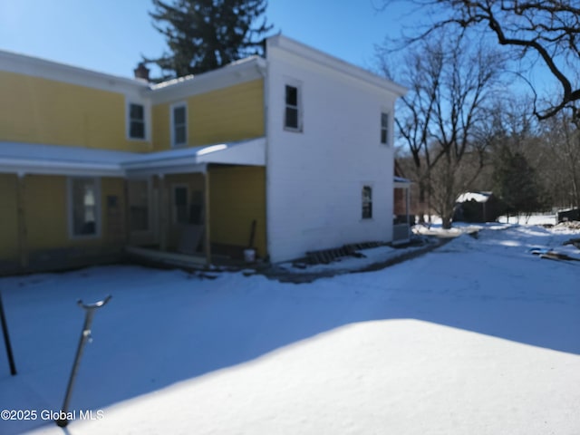 view of snow covered property