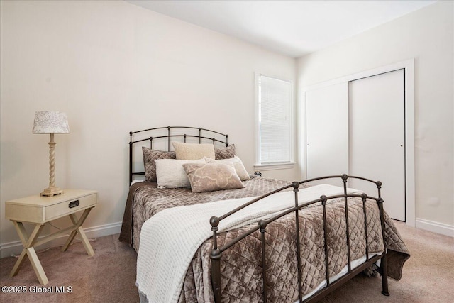 carpeted bedroom with a closet