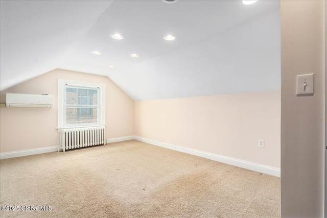 additional living space with radiator heating unit, carpet flooring, vaulted ceiling, and an AC wall unit