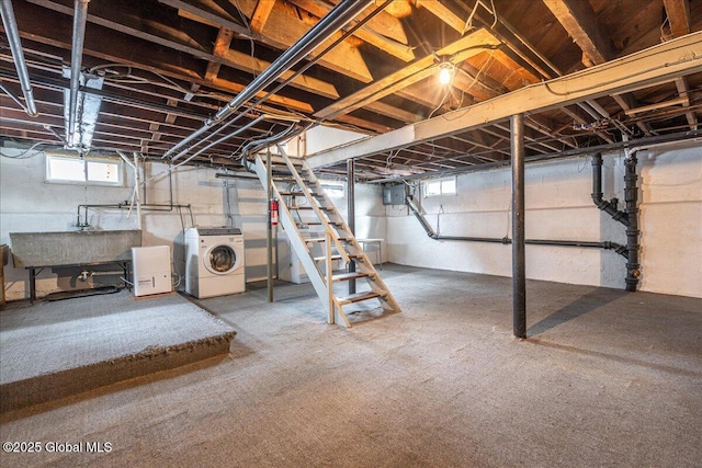 basement with sink and washer / dryer