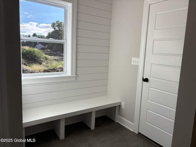 mudroom featuring dark tile patterned flooring