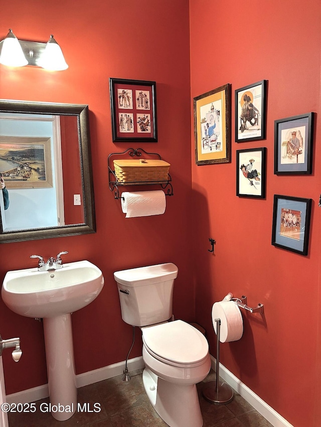 bathroom with sink, tile patterned floors, and toilet