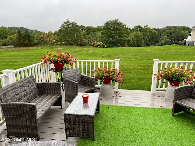 wooden terrace featuring an outdoor hangout area and a yard