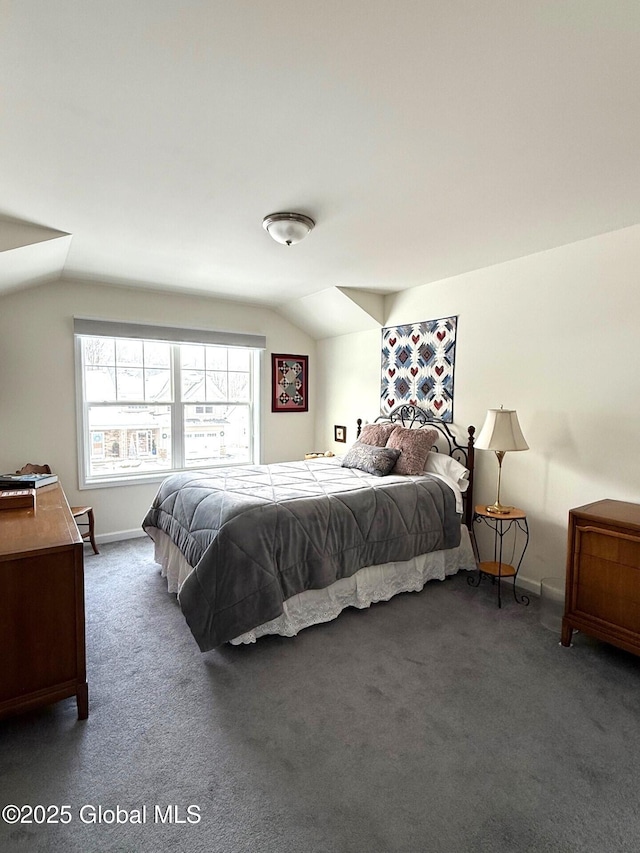 carpeted bedroom featuring lofted ceiling