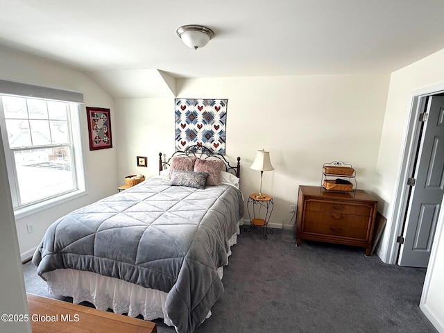 carpeted bedroom featuring lofted ceiling