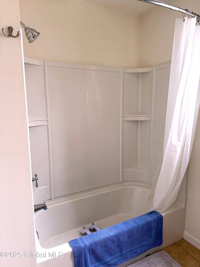 bathroom featuring shower / tub combo with curtain