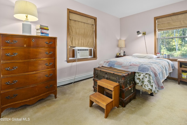 carpeted bedroom featuring cooling unit and a baseboard heating unit