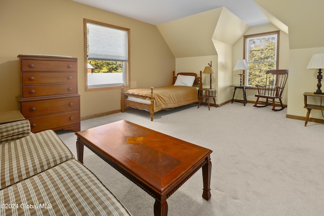 bedroom featuring vaulted ceiling and light carpet