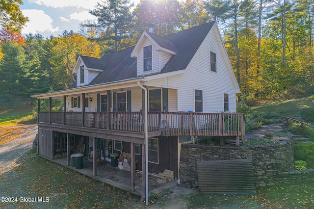 back of house featuring a yard, a patio area, and a deck