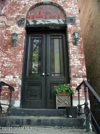 property entrance featuring french doors