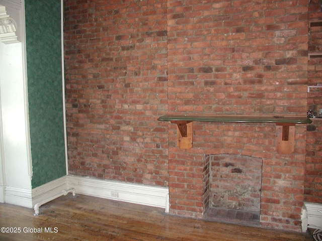 unfurnished living room featuring hardwood / wood-style flooring