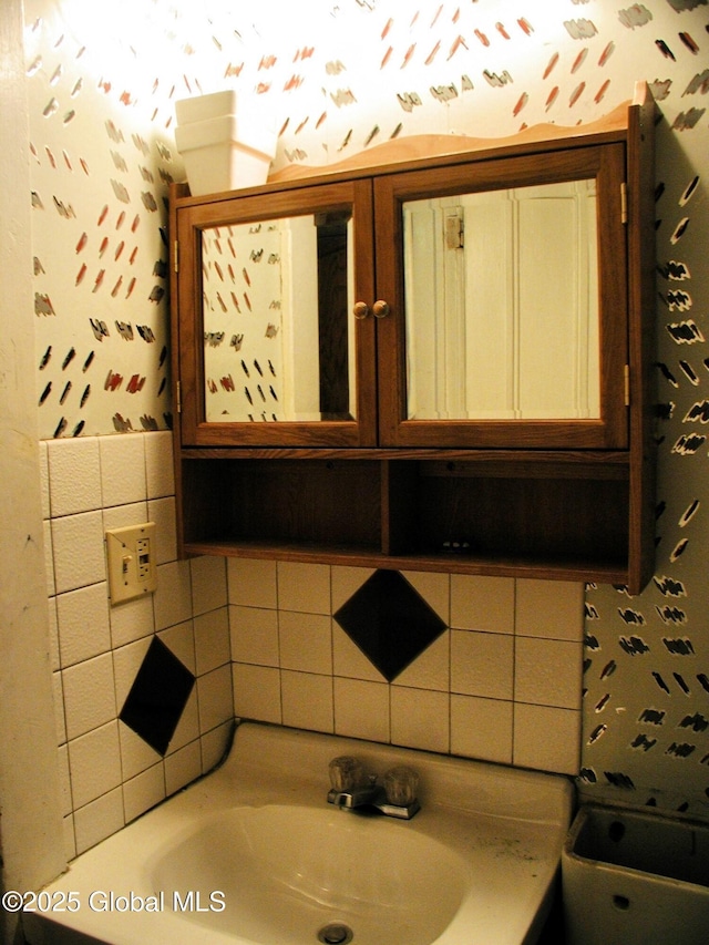 bathroom with backsplash and sink