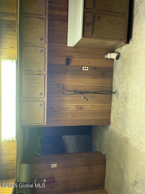 interior space featuring wood walls
