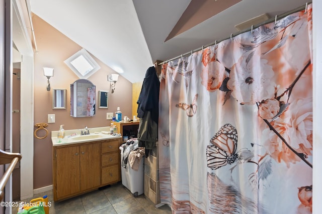 bathroom with vaulted ceiling, curtained shower, vanity, and tile patterned floors