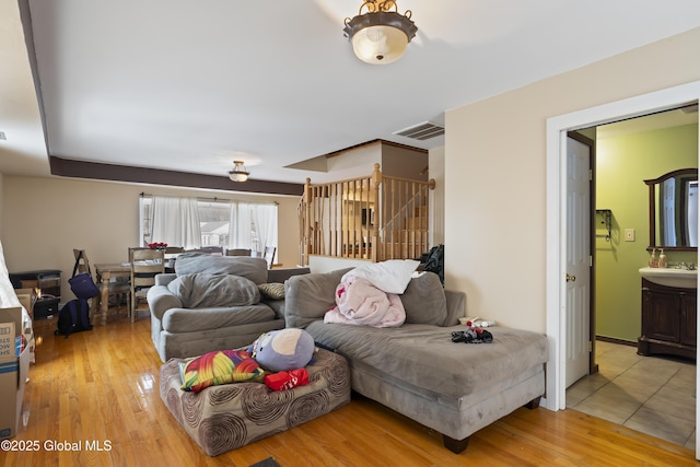 living room with light hardwood / wood-style flooring