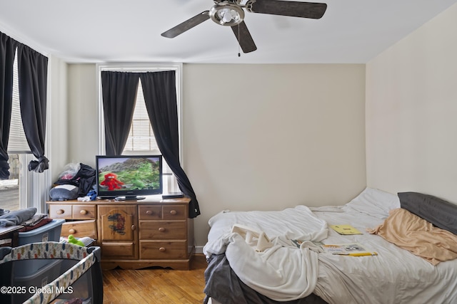 bedroom featuring ceiling fan and light hardwood / wood-style flooring