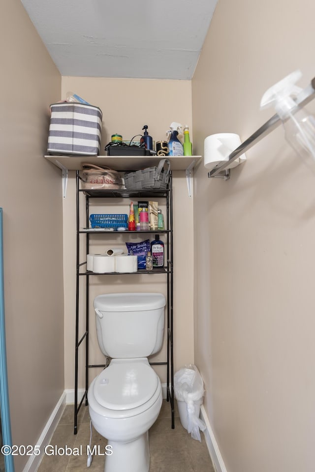 bathroom with tile patterned floors and toilet