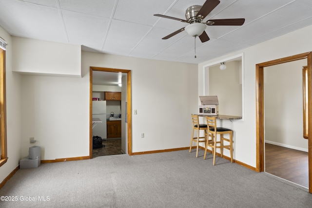 interior space featuring ceiling fan