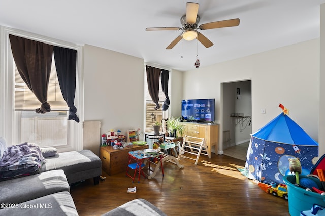 living room with dark hardwood / wood-style floors and ceiling fan