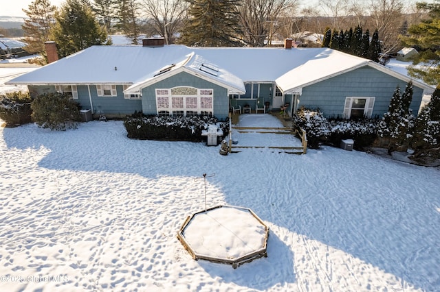 view of snow covered house